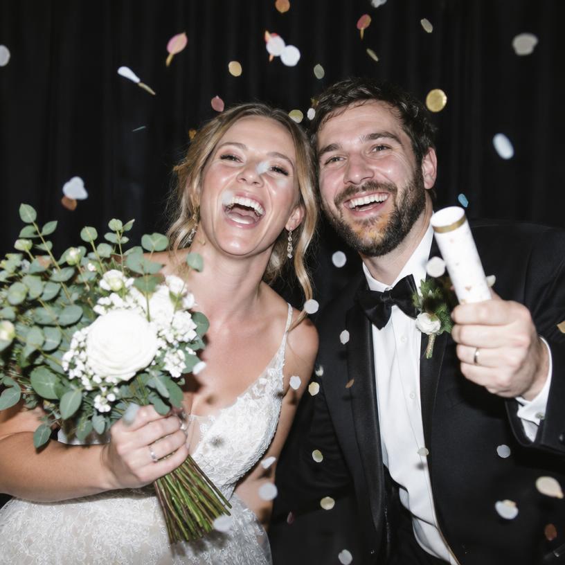 Newlywed couple celebrating in the booth